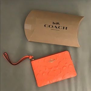 Coach neon orange wristlet NWT